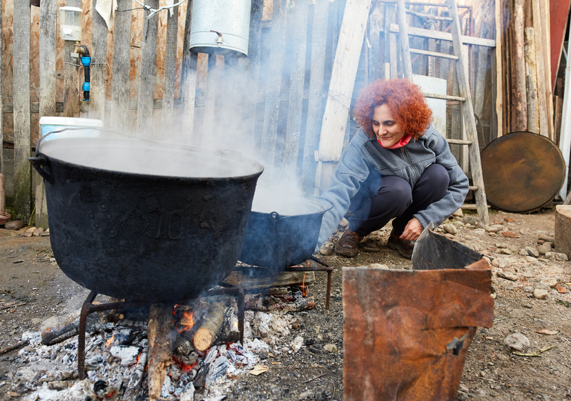 Rural lady boiling water outdoor